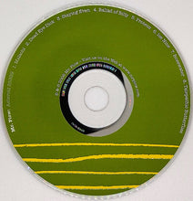 Cargar imagen en el visor de la galería, CD with green label and white center on a white background