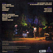 Load image into Gallery viewer, Album cover with band performing on stage in the desert, text detailing tracklist and recording information.