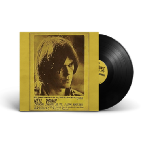 Vinyl record with yellow cover featuring a portrait and album title.