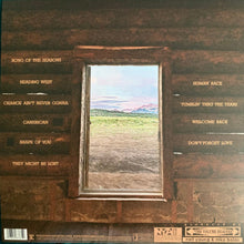 Load image into Gallery viewer, Album cover with window view and text on wooden surface