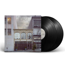 Load image into Gallery viewer, Vinyl records with a cover featuring an urban scene and album title 'Toast' by Neil Young.
