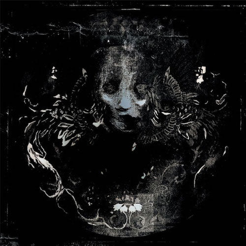 Black and white illustration of a ram's skull with floral elements on a dark background