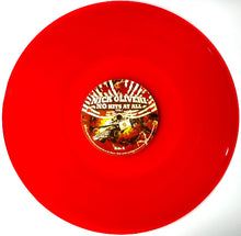 Cargar imagen en el visor de la galería, Red vinyl record with a label featuring 'Nick Oliveri' on a white background