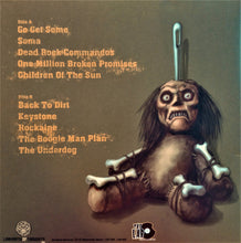 Load image into Gallery viewer, Album cover with a creature holding a needle and text on a brown background