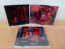 Load image into Gallery viewer, CD set with red and black design on a wooden surface