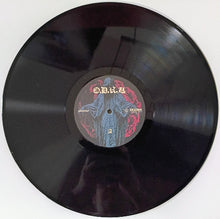 Charger l'image dans la galerie, Vinyl record with a label on a white background
