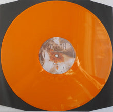 Cargar imagen en el visor de la galería, Orange vinyl record with a label on a black background