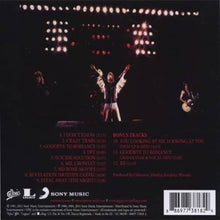 Charger l'image dans la galerie, Album cover with a band performing on stage, featuring text and logos at the bottom.