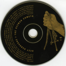 Charger l'image dans la galerie, CD disc with a hand holding a necklace and cross, and text on a black background
