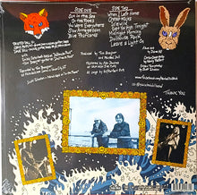 Cargar imagen en el visor de la galería, Album cover with text, images of a fox and rabbit, and a photo of two people on a boat.