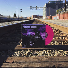 Cargar imagen en el visor de la galería, Vinyl record with 'Phantom Round' cover on train tracks