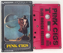 Charger l&#39;image dans la galerie, Cover art for the cassette tape &#39;Pink Cigs&#39; featuring a stylized illustration of a person with a staff in front of a cosmic, celestial background, with the band name and album title below.