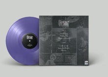 Charger l'image dans la galerie, A vinyl record partially visible behind its sleeve, shown on a light gray background. The record is a translucent purple color, and the sleeve is dark gray with black-toned album artwork and white text.