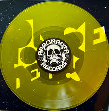 Load image into Gallery viewer, Polyfrenetics - Self Titled album yellow vinyl record with a skull logo and text on a dark background