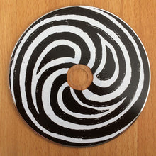 Cargar imagen en el visor de la galería, Electric Octopus - St. Patrick&#39;s Cough CD with round black and white spiral coaster with a wooden center on a wooden surface