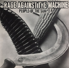 Cargar imagen en el visor de la galería, The image features the album cover of "People of the Sun EP" by Rage Against The Machine. It is a black and white photograph that includes a close-up view of a revolver's barrel and a ear of corn, arranged to create a striking visual contrast.