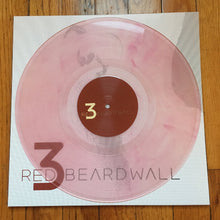 Cargar imagen en el visor de la galería, Vinyl record with a pink and brown design on a white label, featuring &#39;Red Beard Wall&#39; branding.
