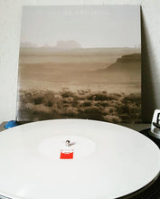Charger l&#39;image dans la galerie, Vinyl record with a landscape cover on a turntable