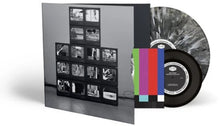 Load image into Gallery viewer, Vinyl record with a colorful label and a black and white photo album on a white background