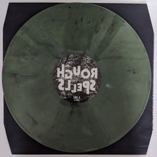 Charger l'image dans la galerie, Vinyl record with a label on a black background