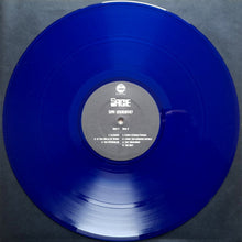 Cargar imagen en el visor de la galería, Blue vinyl record with a label on a gray background