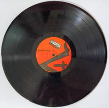 Cargar imagen en el visor de la galería, Vinyl record with an orange label on a white background