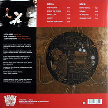 Cargar imagen en el visor de la galería, Vinyl record sleeve with tracklist and mechanical design on a red and brown background