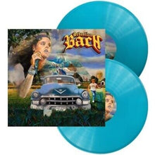 Load image into Gallery viewer, Vinyl record with a colorful cover featuring a person singing into a microphone, a car, and a scenic background. The vinyl is blue.