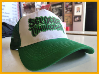 Green and white cap with 'Sergeant Thunder' text on a blurred indoor background