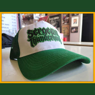 Green and white cap with text on a table