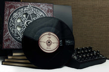 Cargar imagen en el visor de la galería, Record cover art featuring a black and white design with a central spiral motif surrounded by ornate patterns, with red accents along the edges.