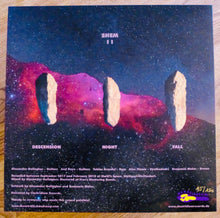 Cargar imagen en el visor de la galería, Album cover with cosmic design and text on a wooden surface