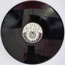 Cargar imagen en el visor de la galería, Vinyl record with a decorative label on a white background