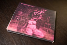 Load image into Gallery viewer, Decorative notebook with fish illustration on a wooden surface