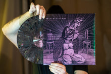 Cargar imagen en el visor de la galería, Person holding a vinyl record with a purple and black cover featuring an illustration of a winged creature.