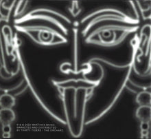 Cargar imagen en el visor de la galería, Black and white mask with intricate designs on a dark background
