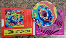 Charger l'image dans la galerie, Colorful CD with a spiral design on a matching CD case.