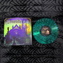 Cargar imagen en el visor de la galería, Album cover art for Sonolith featuring a gothic-style building with a large eye emblem, a full moon, and candles in the foreground.