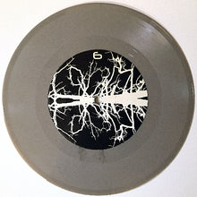 Load image into Gallery viewer, Vinyl record with a white abstract design on a black background