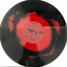Cargar imagen en el visor de la galería, Vinyl record with a red label on a white background