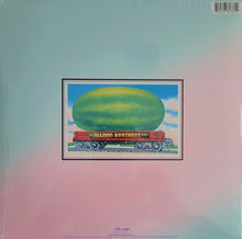 Load image into Gallery viewer, Album cover with a colorful illustration of a train with a large greenmelon on a pastel gradient background