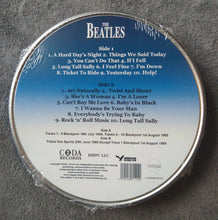 Charger l'image dans la galerie, Disc with The Beatles tracklist on a gray background
