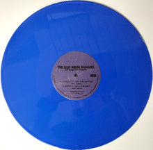 Charger l'image dans la galerie, Blue vinyl record with a label on a white background