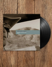 Cargar imagen en el visor de la galería, Vinyl record with cover on a wooden surface