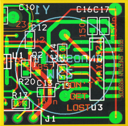 Close-up of a printed circuit board with various electronic components and text.