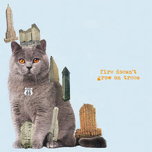 Charger l'image dans la galerie, Gray cat surrounded by miniature buildings with 'fire doesn't grow on trees' text on a light blue background