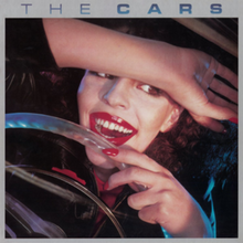 Cargar imagen en el visor de la galería, Album cover of 'The Cars' with a person holding a steering wheel.
