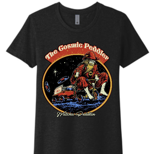 Black T shirt with the logo and text 'The Cosmic Peddler' at the top and 'Wahtcha Peddlin' at the bottom all over a white background