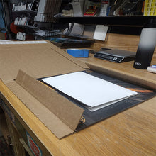 Load image into Gallery viewer, Poster folded inside record box.