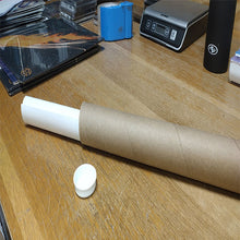 Load image into Gallery viewer, Poster rolled in poster tube.
